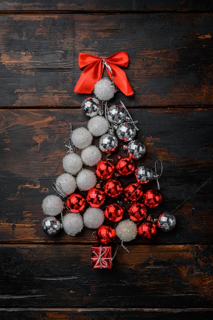 Christmas tree from toys concept set, on old dark  wooden table background, top view flat lay