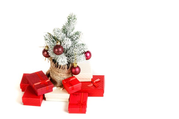 Christmas tree gift boxes with toys on a white background