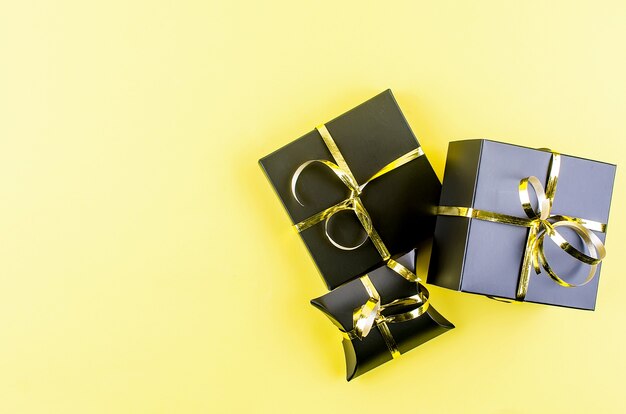 Christmas tree and gifts on yellow background