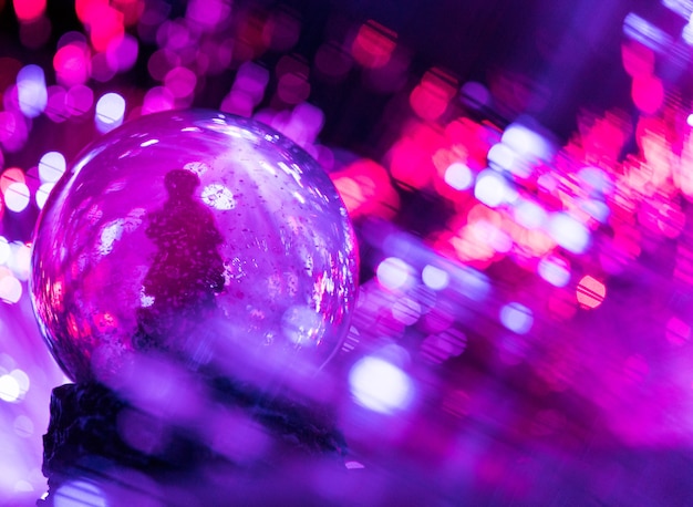 Christmas tree globe with colorful bokeh lights