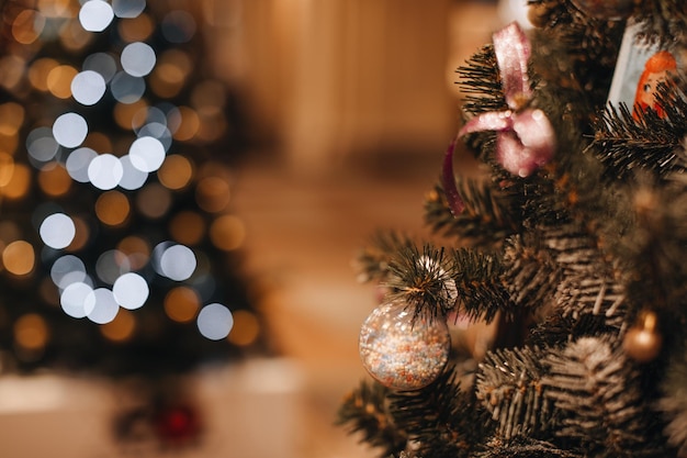 Christmas tree green branches decorated with white interesting Christmas ball New year winter