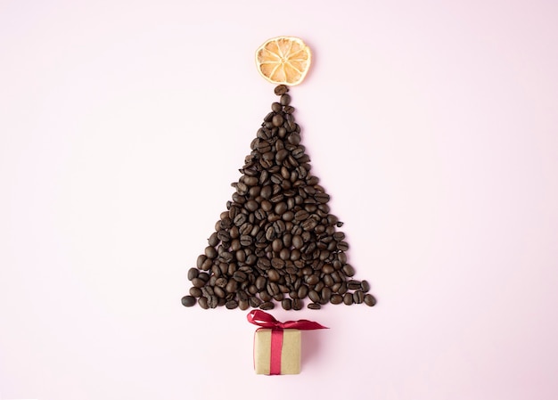 Christmas tree made of coffee beans on white