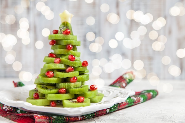 Christmas tree made from kiwi and pomegranate