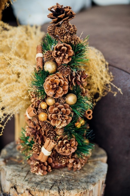 Christmas tree made of natural fir and pine cones. New Year and winter holidays. Christmas, home decor.