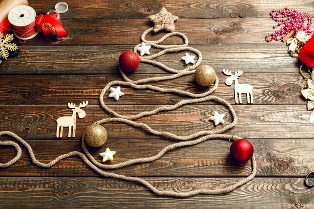 Christmas tree made of rope on a wooden table