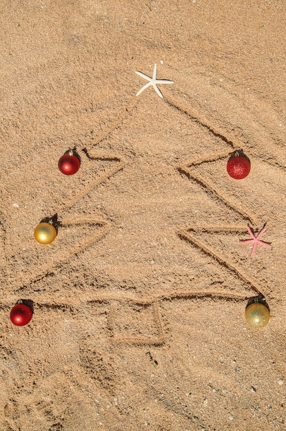 Christmas tree made of shells in the sand. Selective focus. nature.