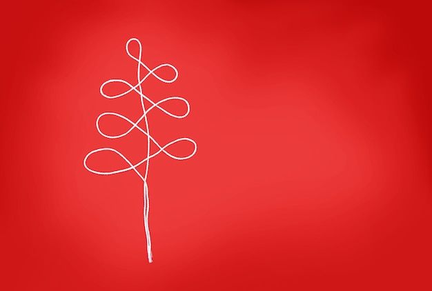 The christmas tree made of the white rope on the red background
