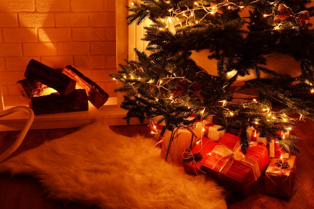 Christmas tree near fireplace in room