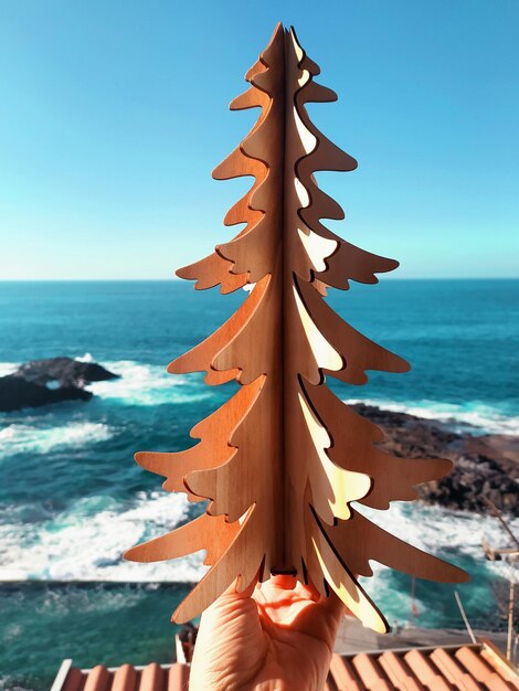 Premium Photo | Christmas tree on the ocean background