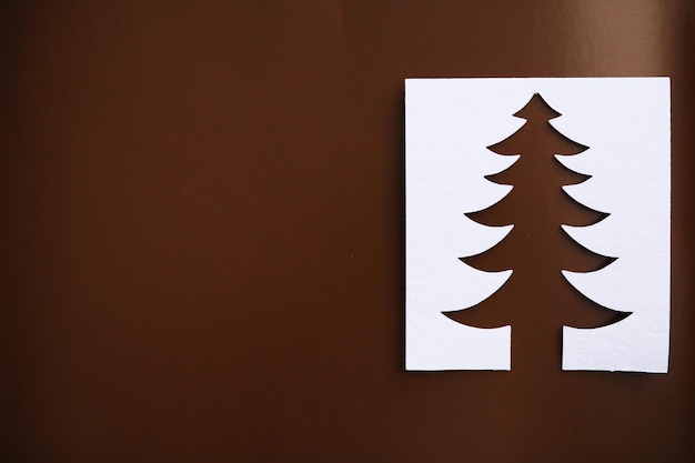 christmas tree paper cutting design papercraft card. white, red and green color