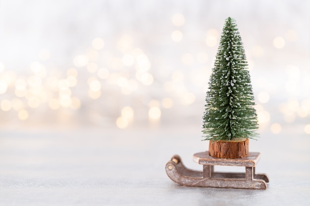 Christmas tree on silver, bokeh background