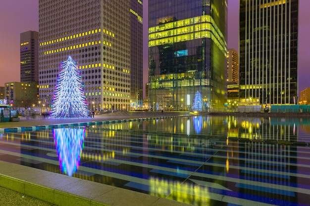 Christmas tree among the skyscrapers in Paris, France.
