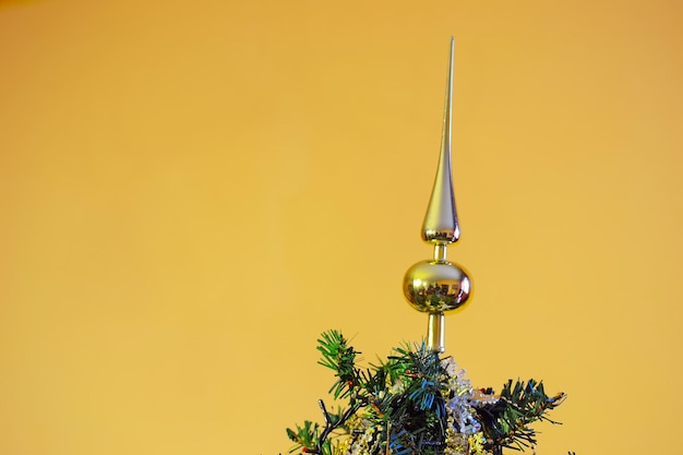 Christmas tree topper on a golden background