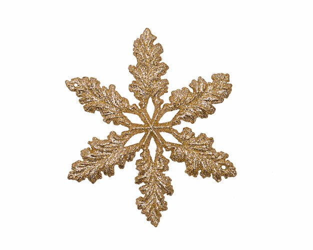 Christmas tree toy is a golden snowflake isolated on a white background