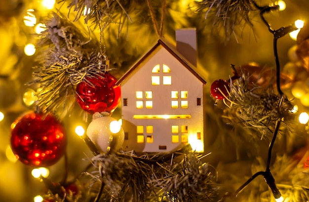 Christmas tree toy and toy house in the foreground