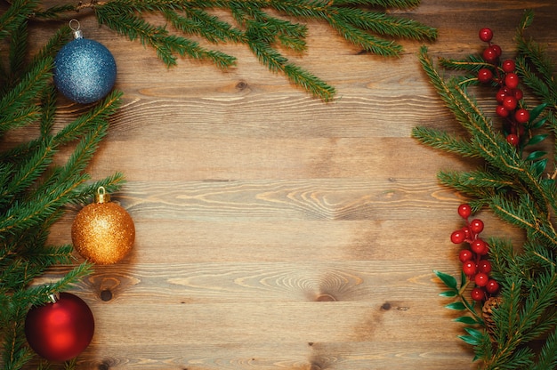 Christmas tree with decoration on a wooden Board