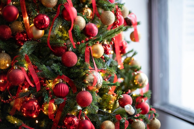 Christmas tree with red and gold balls. High quality photo