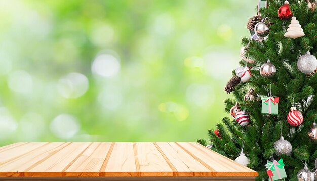 Christmas tree with top wood table and blur background before christmas day