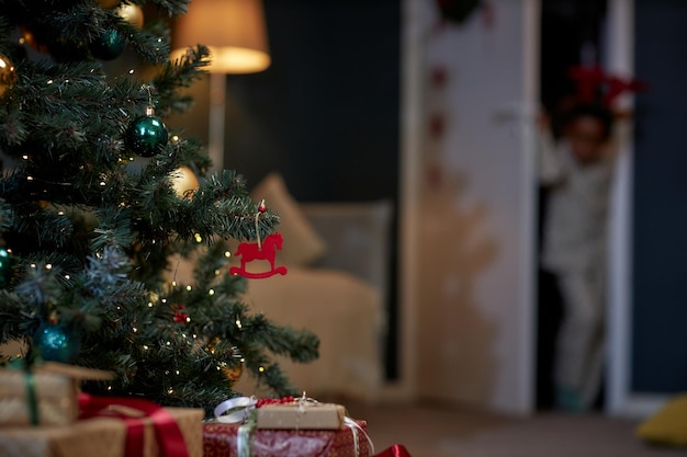 Christmas tree with twinkling light red ornament