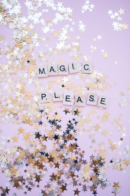 A christmas tree with white letters that say magic.