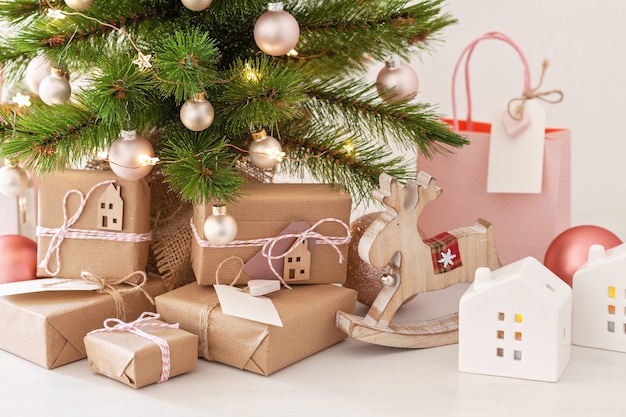 Christmas tree with wrapped gifts. 