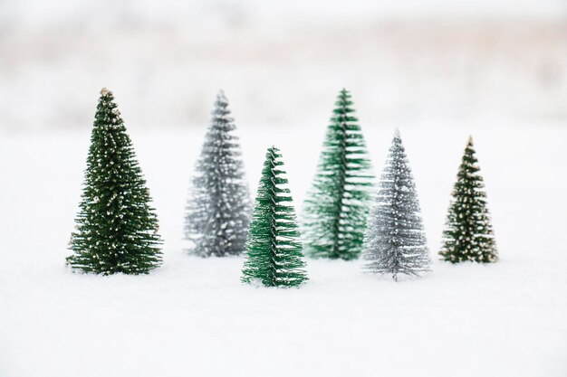 Photo christmas trees in a snowdrift on a snowy winter december day new year's card