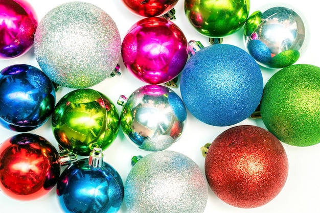 Christmas wallpaper with colorful balls ornament new year decorations on white background close up