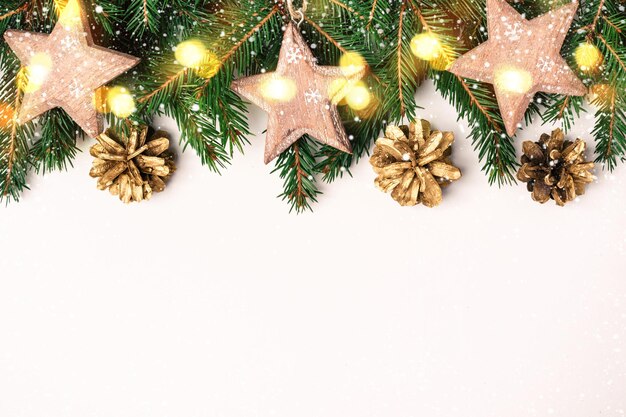 Christmas white background shining gold and pink balls and confetti border