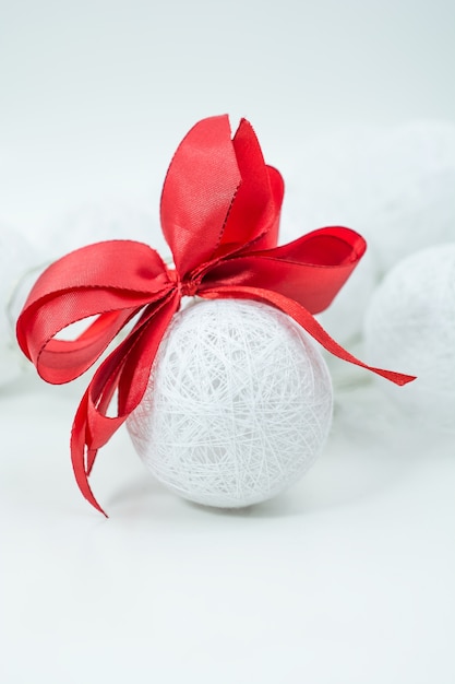 Christmas white bauble with red bow