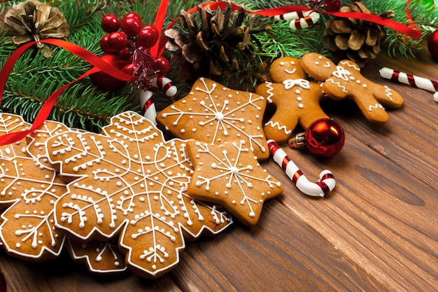 Christmas  with branch of fir tree decorated by gingerbread.