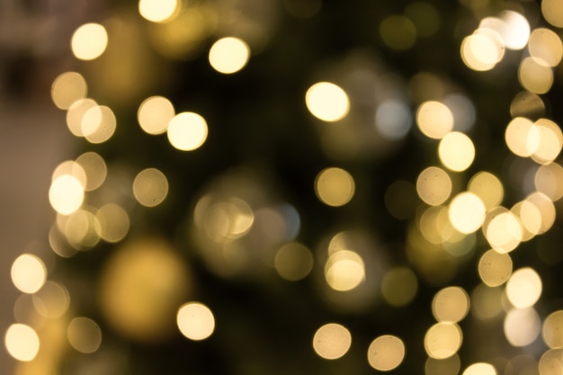 Natale con sfondo chiaro bokeh oro. sfocatura astratta di natale.