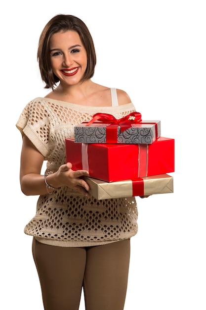 Christmas woman portrait holding christmas gift. Smiling happy woman