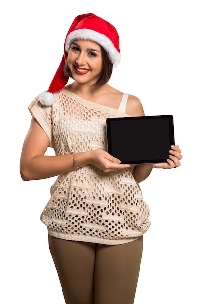 Christmas woman portrait holding tablet. Smiling happy woman