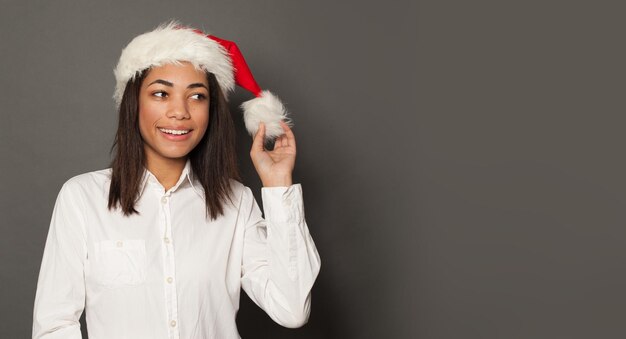 Christmas woman Santa on gray background