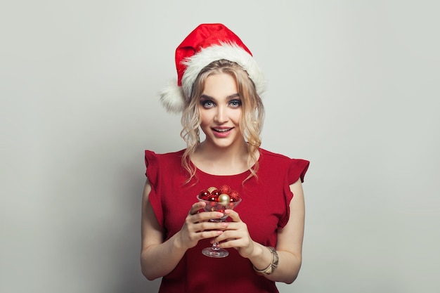 Christmas woman with Xmas decorations on white background Christmas holiday and New Year party portrait