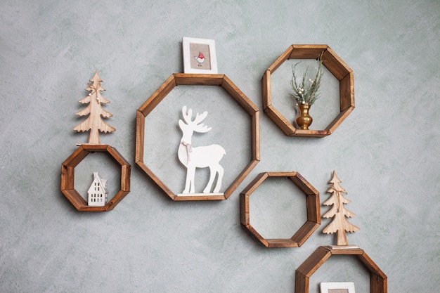 Christmas wood decoration on grey wall. Winter holidays.