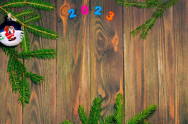 Christmas wooden background with decorations and a place to copy.