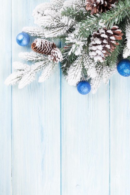 Christmas wooden background with fir tree and decor