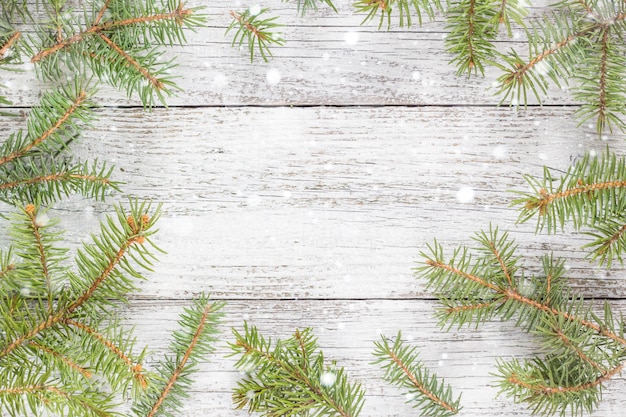 Christmas wooden background with fir tree. top view copy\
space