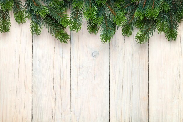 Christmas wooden background with fir tree