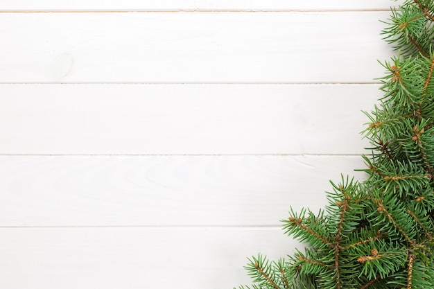 Christmas wooden background with fir tree. 