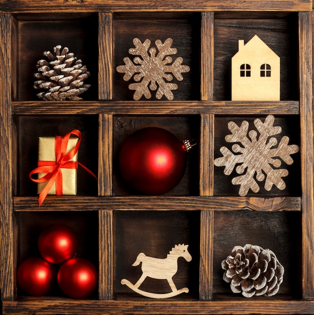 Christmas wooden box with red ornaments