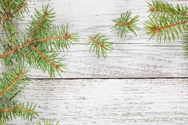 Christmas wooden surface with fir tree. 