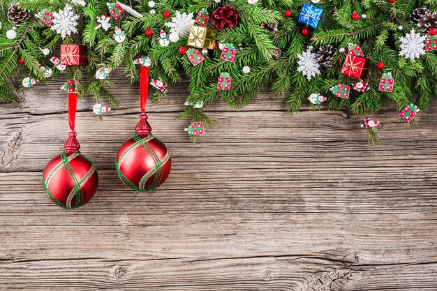 Christmas wooden with fir tree branches decorated with Christmas ornaments