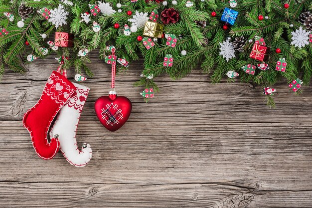 Christmas wooden with fir tree branches decorated with Christmas socks