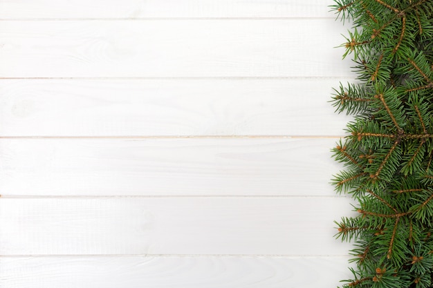 Christmas wooden  with fir tree frame and , top view empty space 