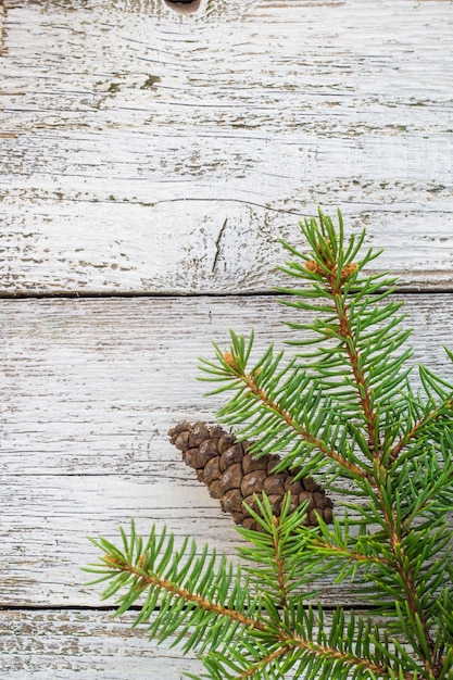 Photo christmas wooden with snow fir tree.