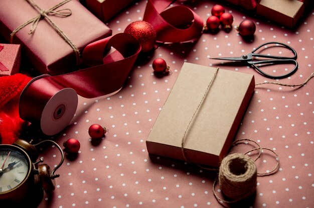 Christmas wrapping table with gift boxes