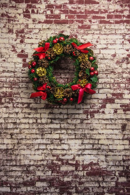 Christmas wreath on  brick wall background