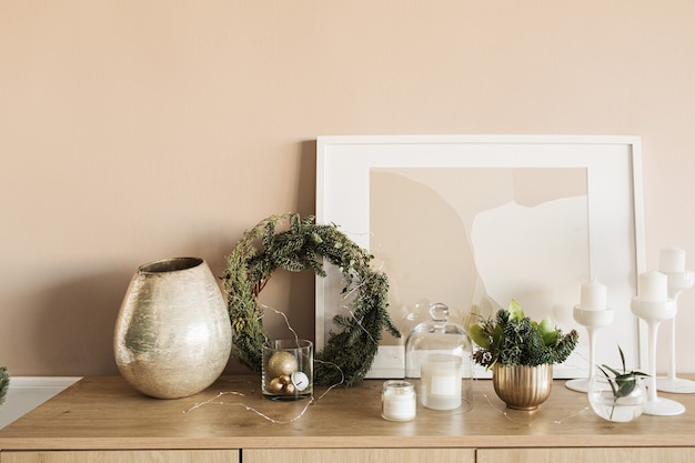 Christmas wreath frame, candles, frame, fir branches, golden decorations on wooden table